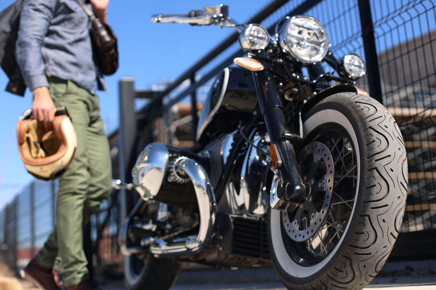 Low angle view of classic motorcycle with detailed tire tread and chrome accents.