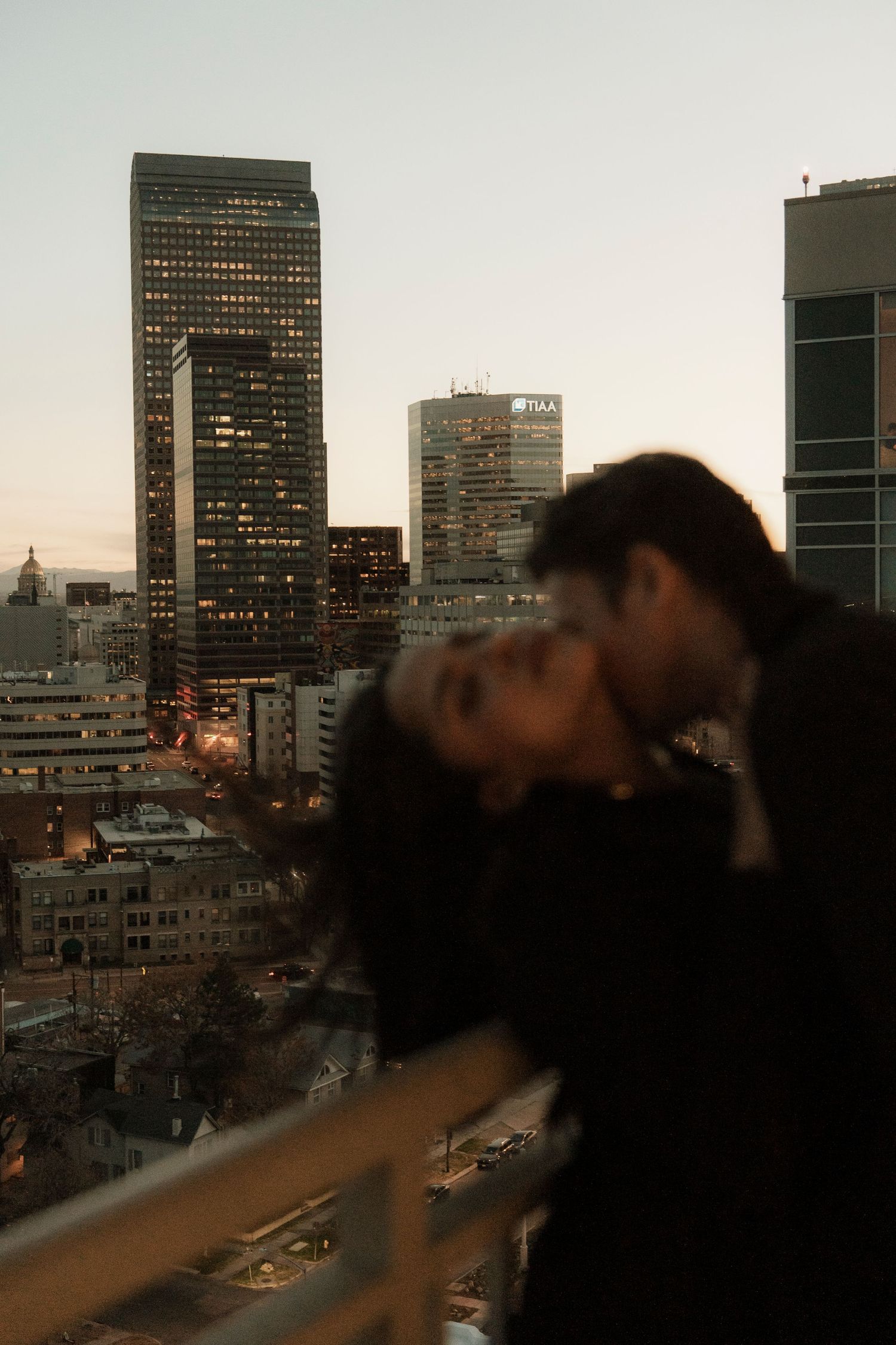 Intimate moment captured in golden field during sunset.