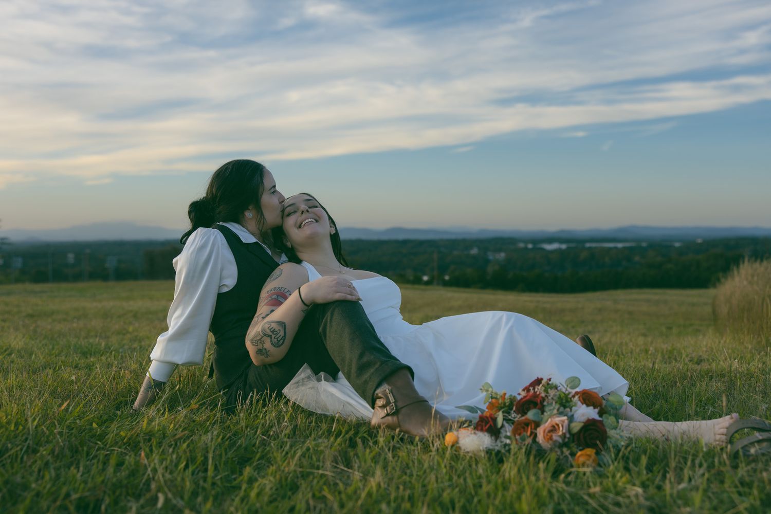 LGBTQ couple holding hands at a romantic elopement mountain overlook in Asheville, North Carolina