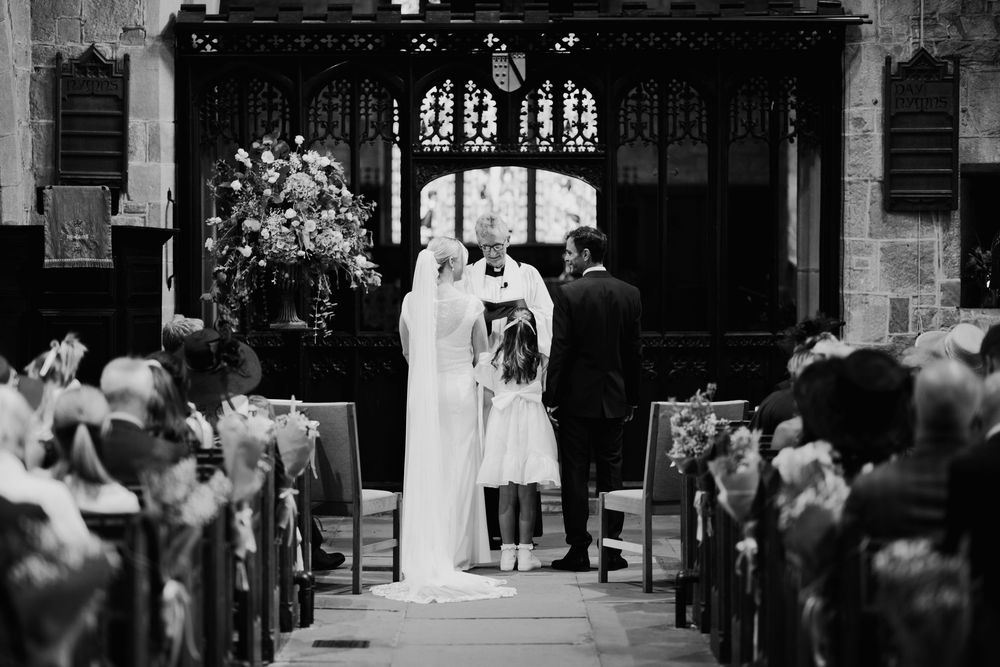 A black and white photo montage shows multiple wedding ceremony scenes in a church setting.