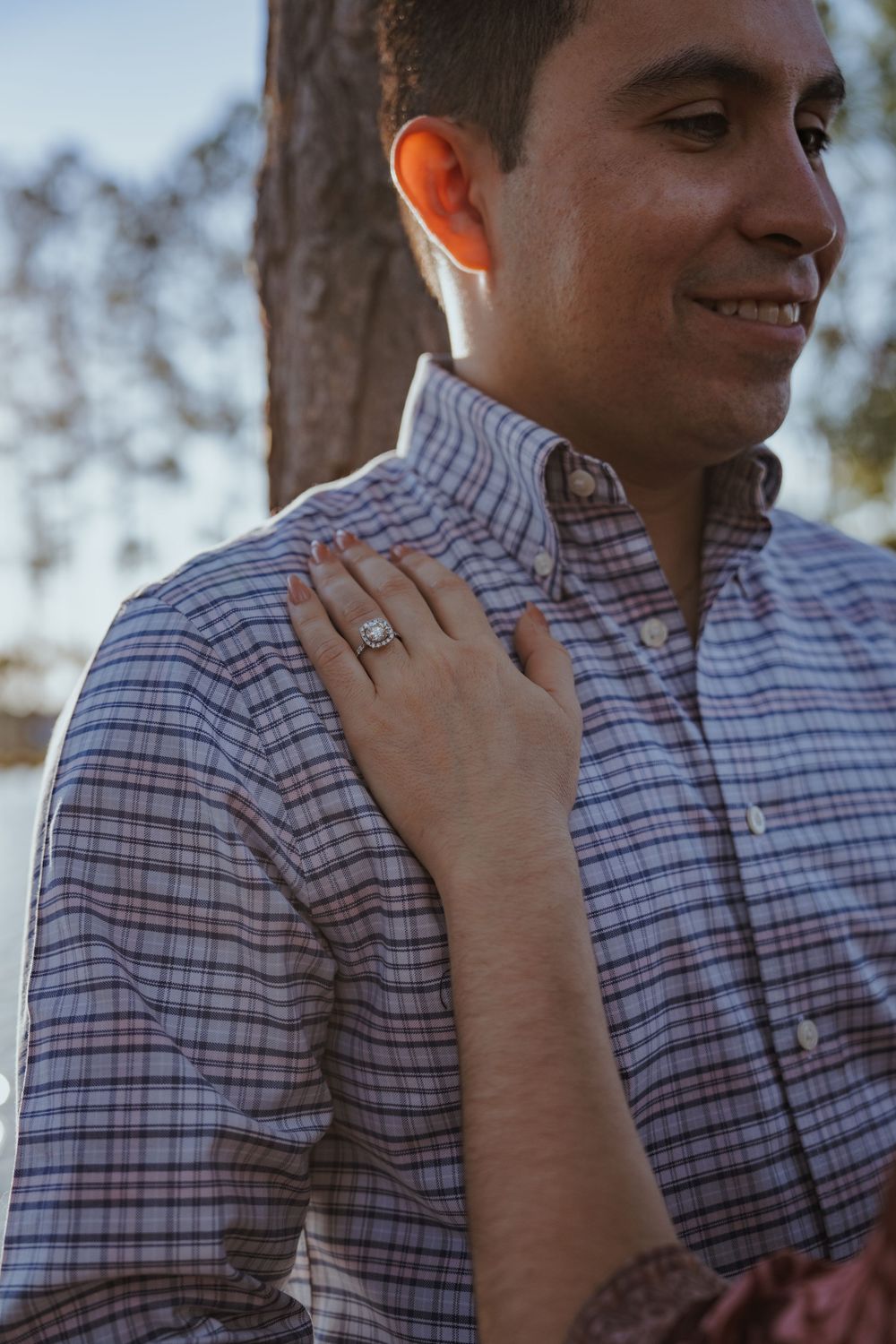 Close-up shots highlighting an engagement ring against a plaid shirt backdrop.