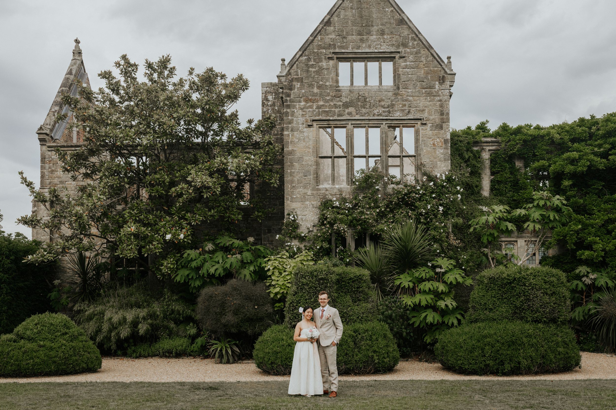 Wedding photographer at Nymans Gardens capturing relaxed couple portraits in West Sussex