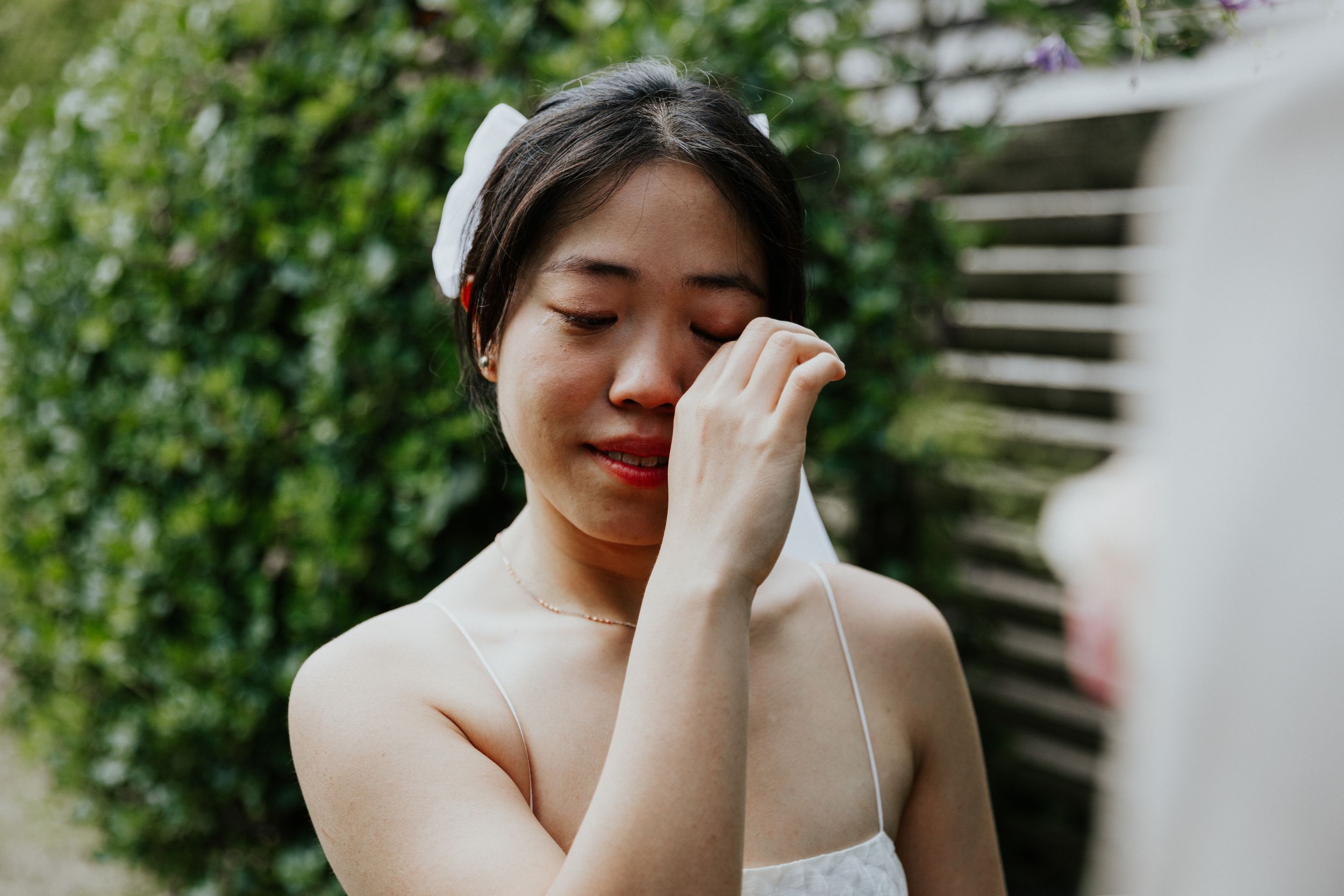 emotional portrait of bride during first look