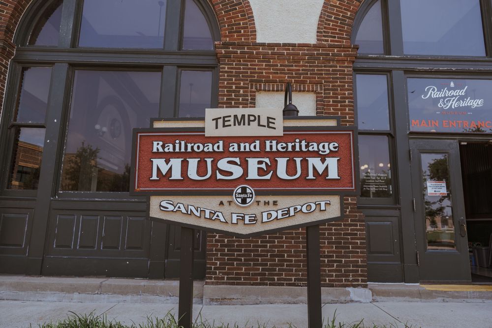 Exterior view of a brick building with Railroad and Heritage Museum signage.