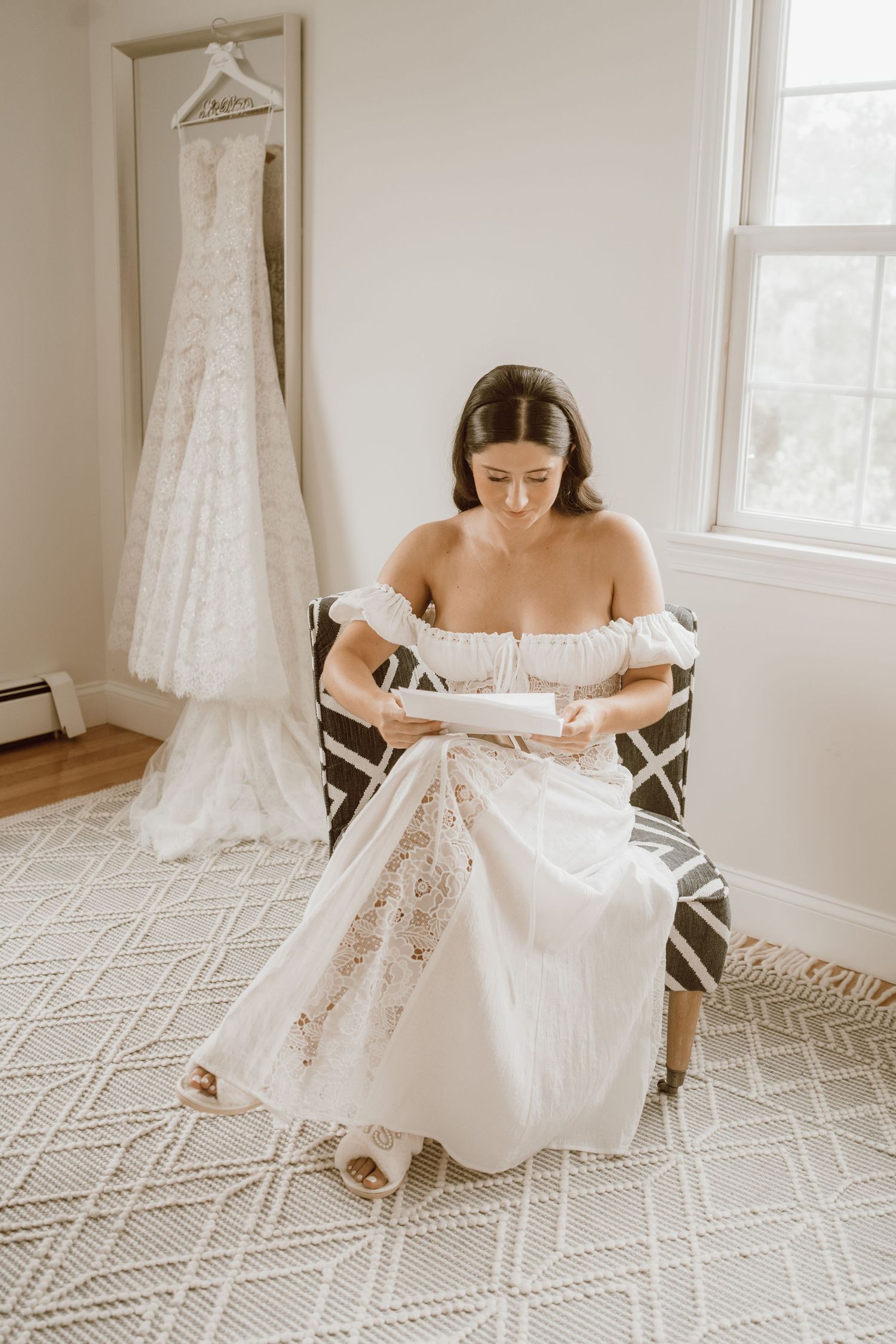 A series of photos showing a white wedding dress being arranged on a geometric patterned carpet in a bright room.