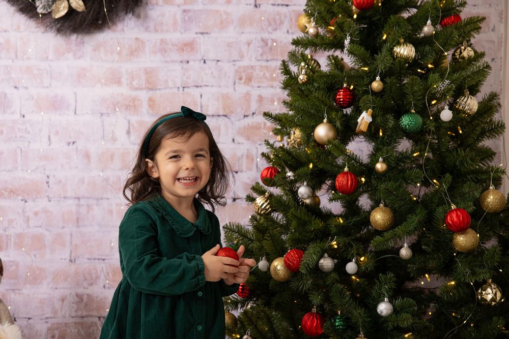 A festive Christmas setting with a decorated tree, presents, and twinkling lights.