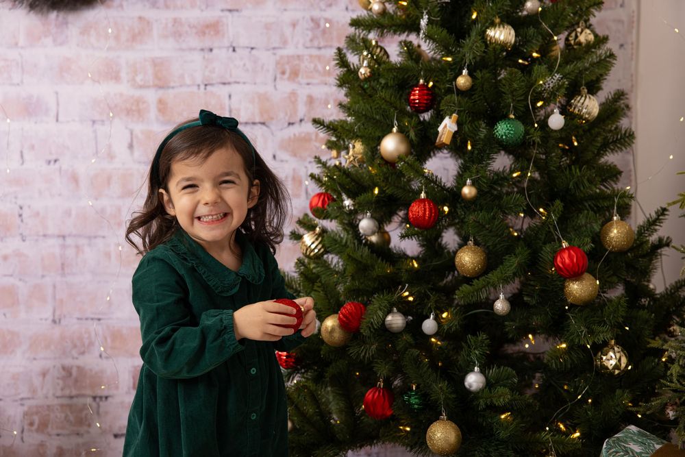 A cheerful holiday scene with a decorated Christmas tree and wrapped presents.