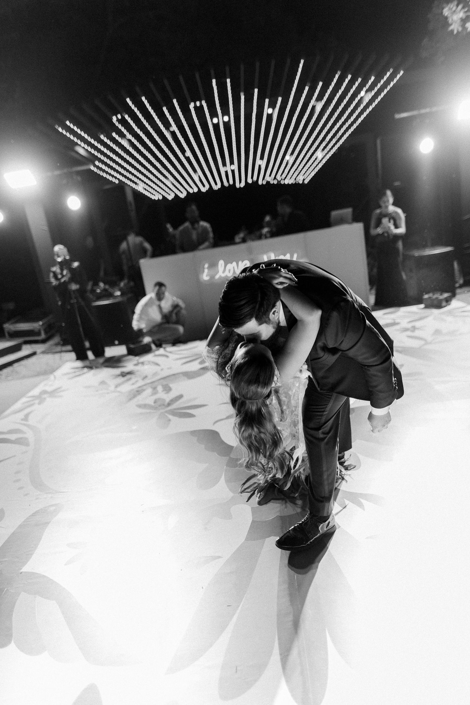 Black and white editorial wedding photograph capturing a couple’s dramatic first dance during a luxury destination wedding.