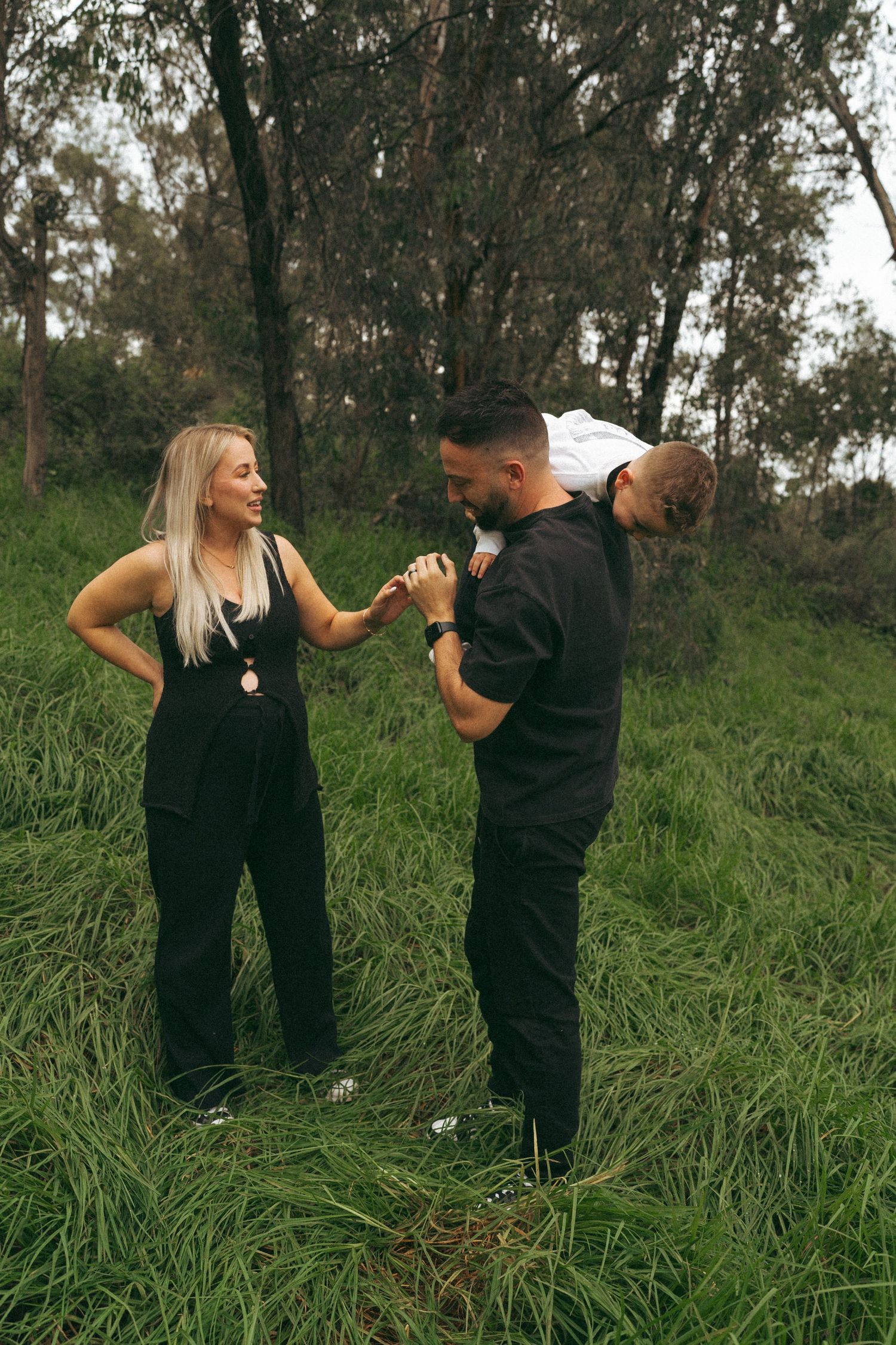 Dynamic family photo sequence showing playful interactions in nature.