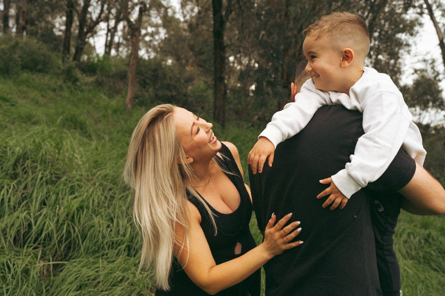 A candid photo series showing a couple's joyful interaction in a natural setting.