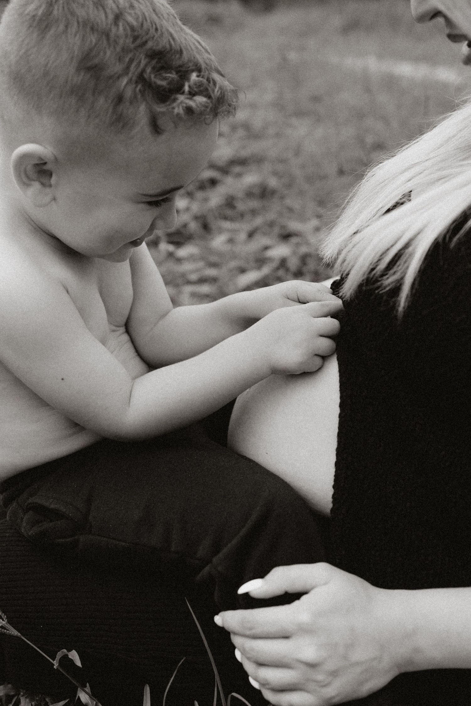 Monochromatic series showing nurturing moments between parent and child.