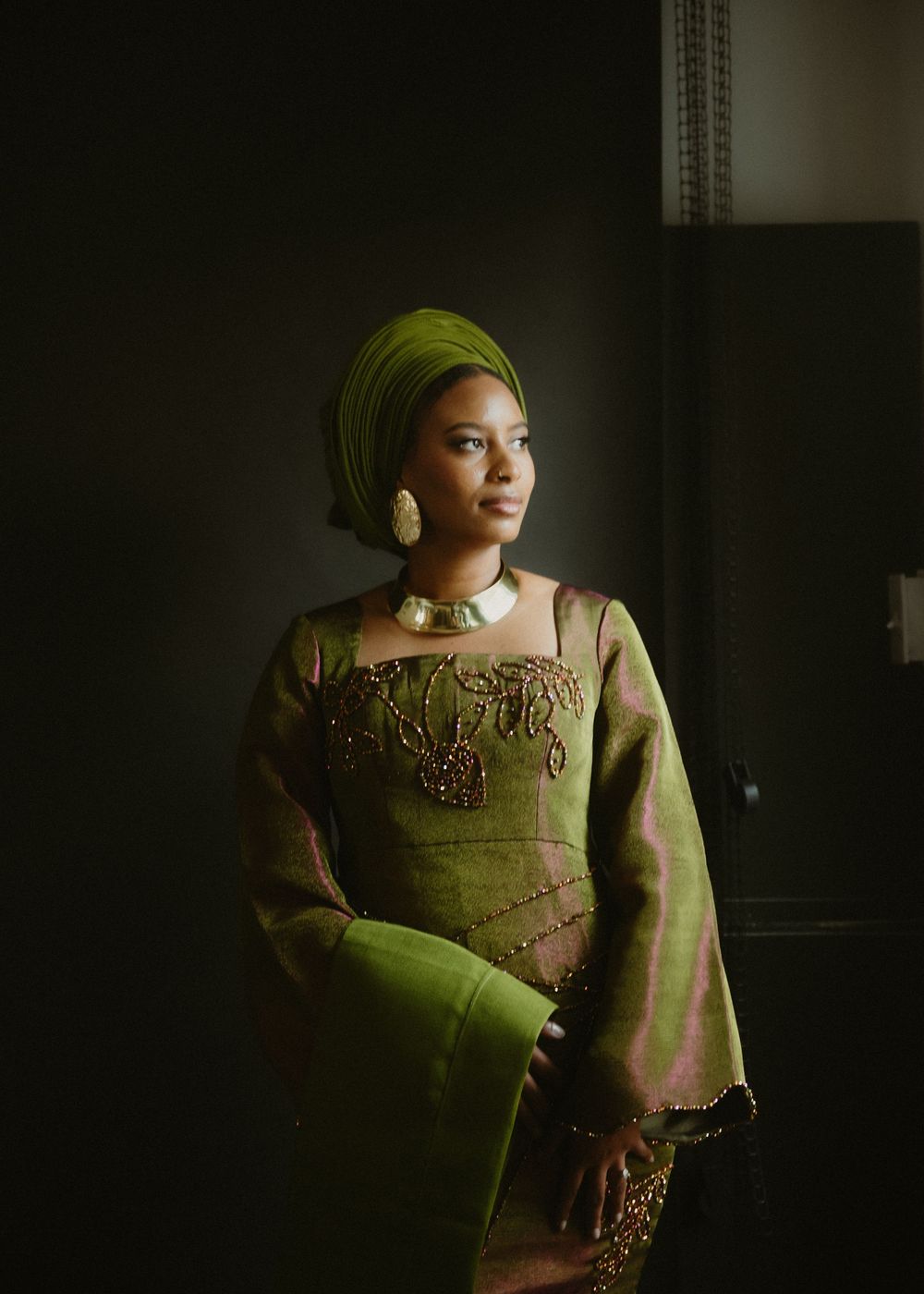 Artistic portrait series featuring green and gold traditional Nigerian fashion.