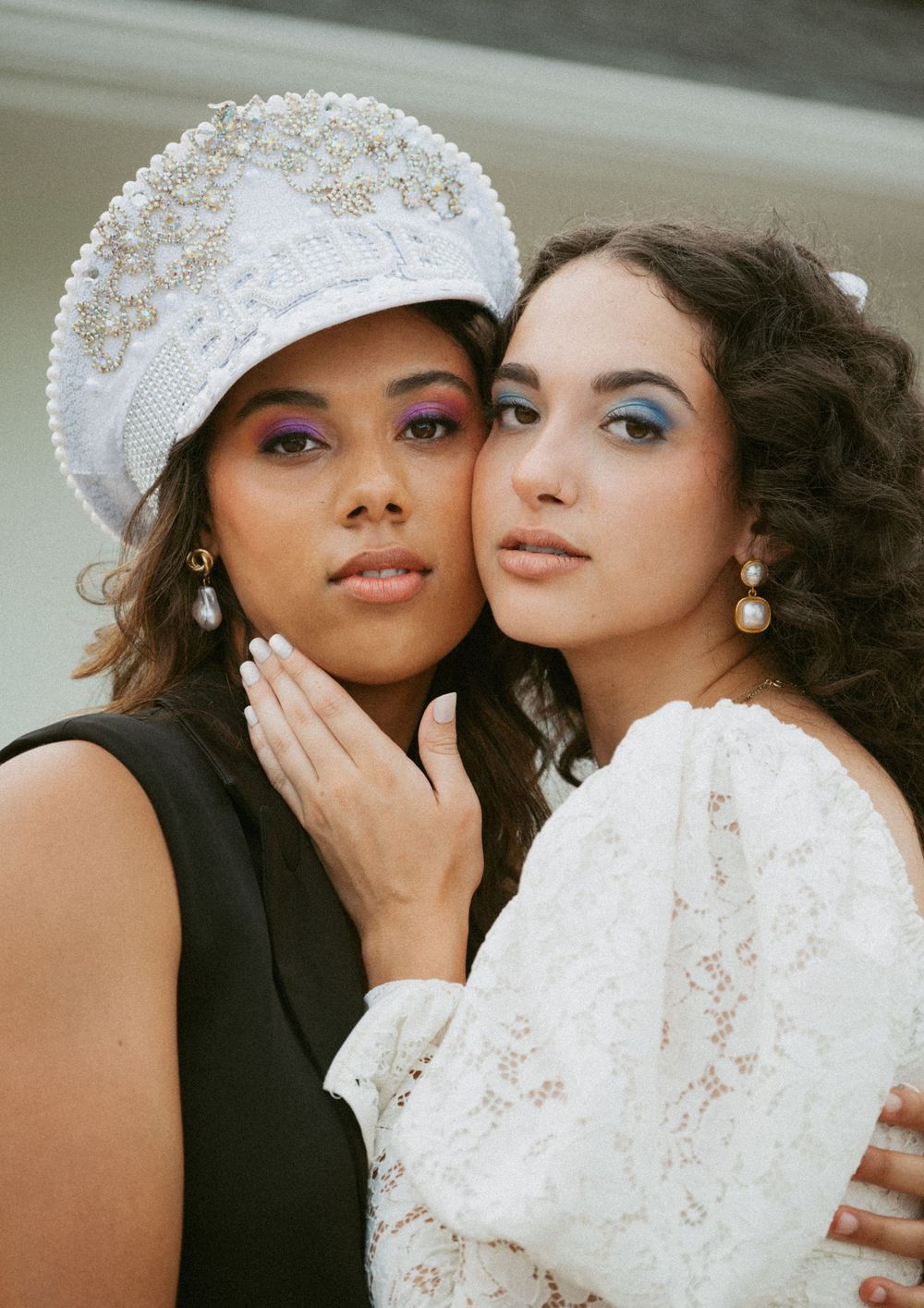 Two people in contrasting black and white outfits pose intimately in a series of romantic photoshoot moments.