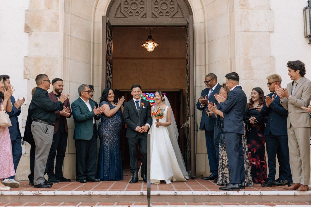 Guests cheer for the newlyweds outside of the historic Santa Barbara Unitarian Society building.