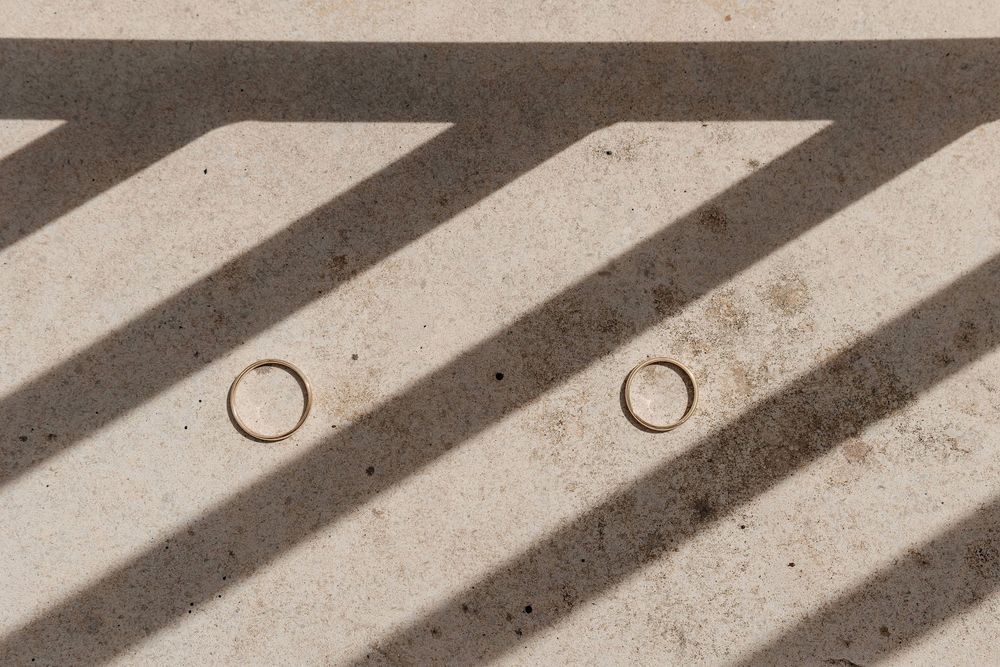 Diagonal black and white stripes create a bold geometric pattern with circular cutouts in the corner.