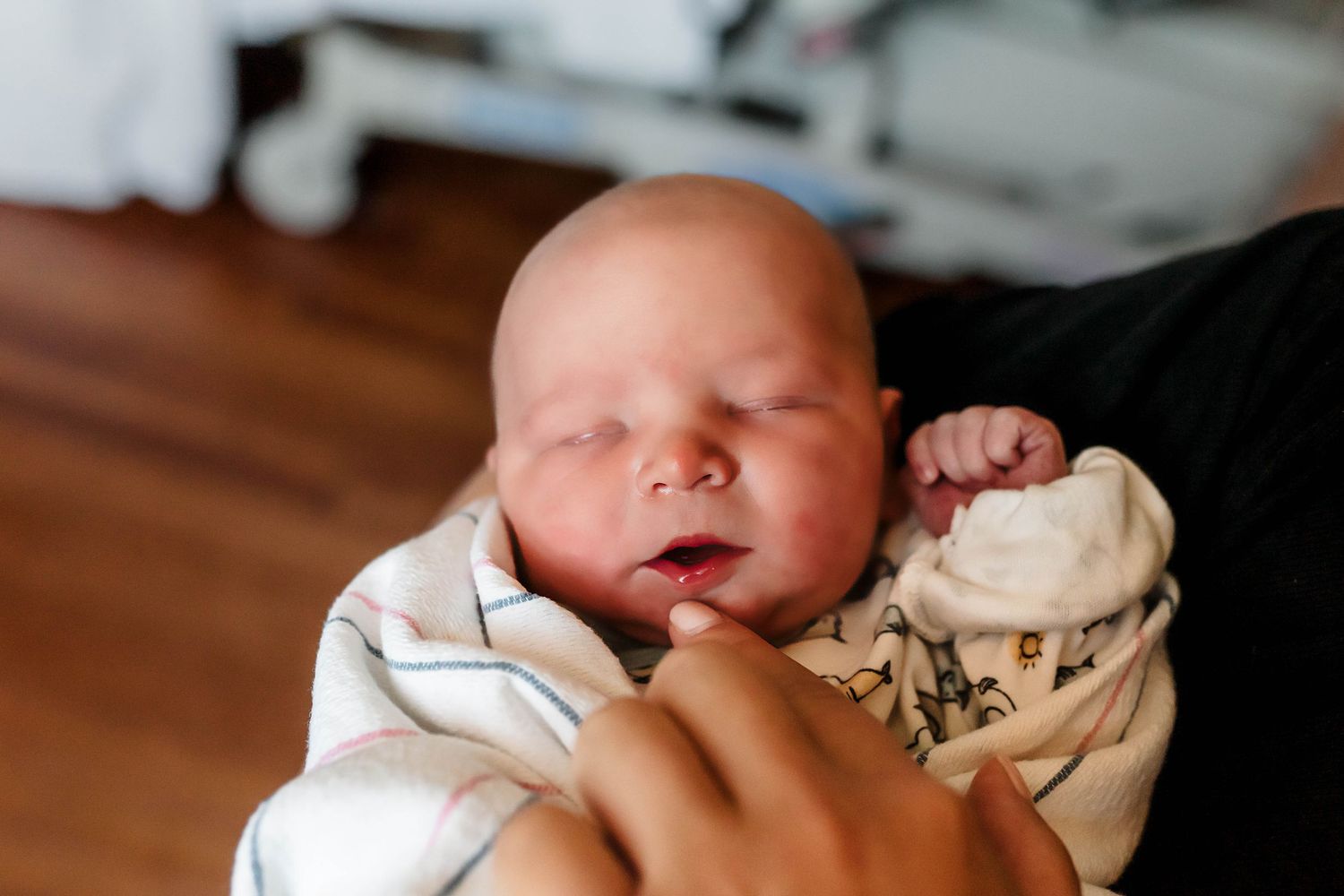 Baby with eyes closed; newborn first 48 session.