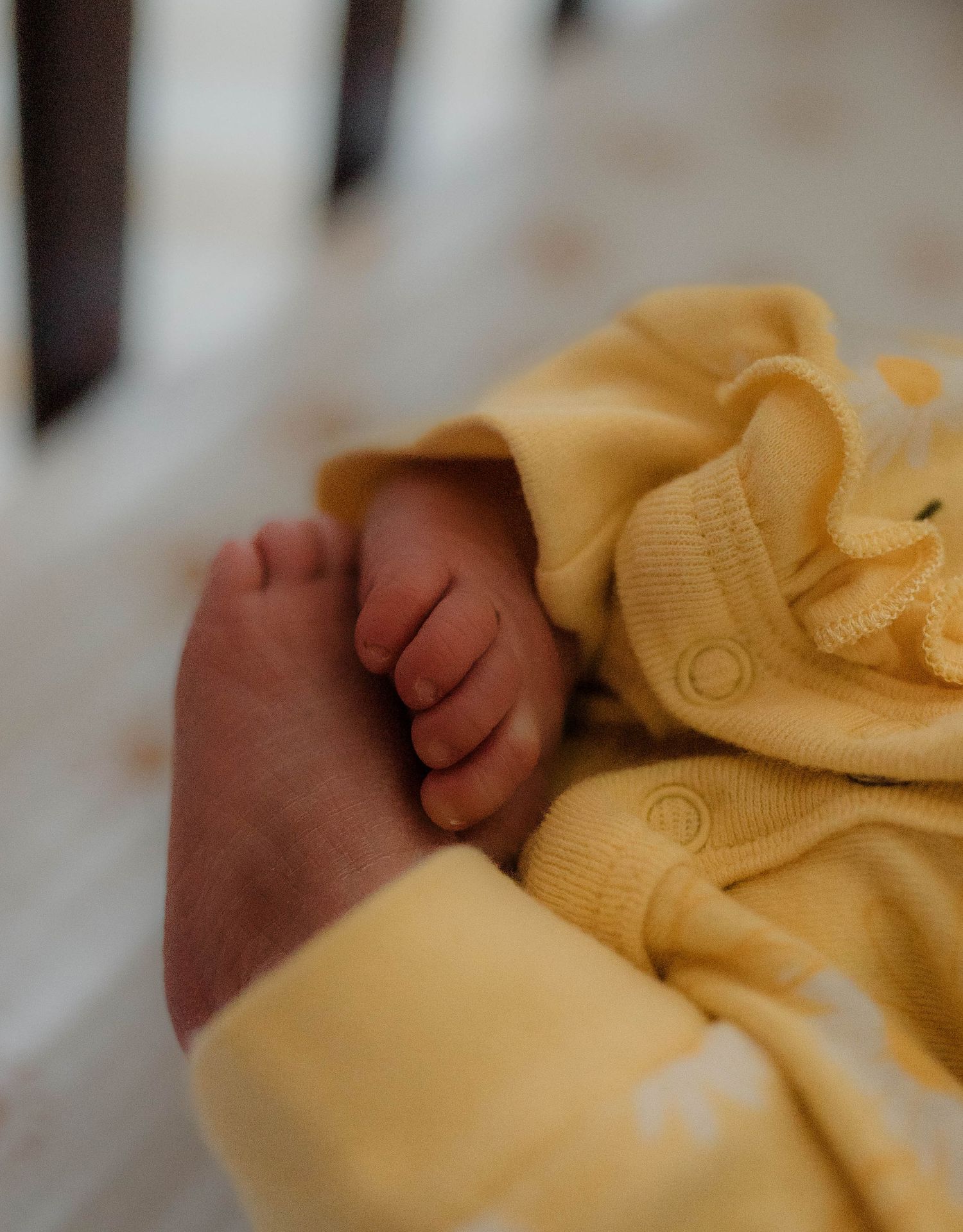 Newborn feet curved into each other during fresh 48 session.
