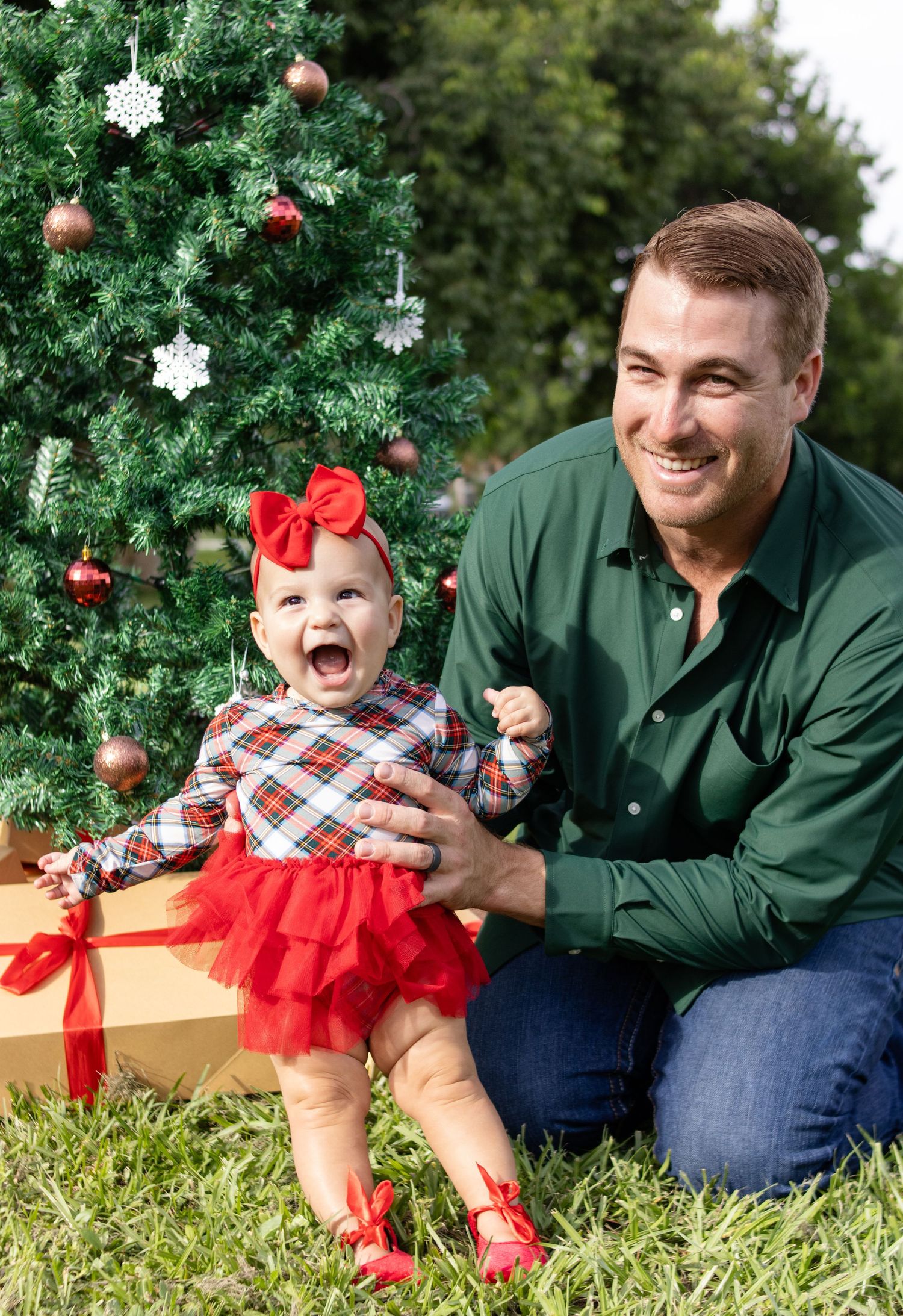 baby and father laughing outdoor christmas photo