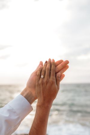Romantic sunrise couple session on the peaceful coast of Badalona Beach with a clear Mediterranean backdrop