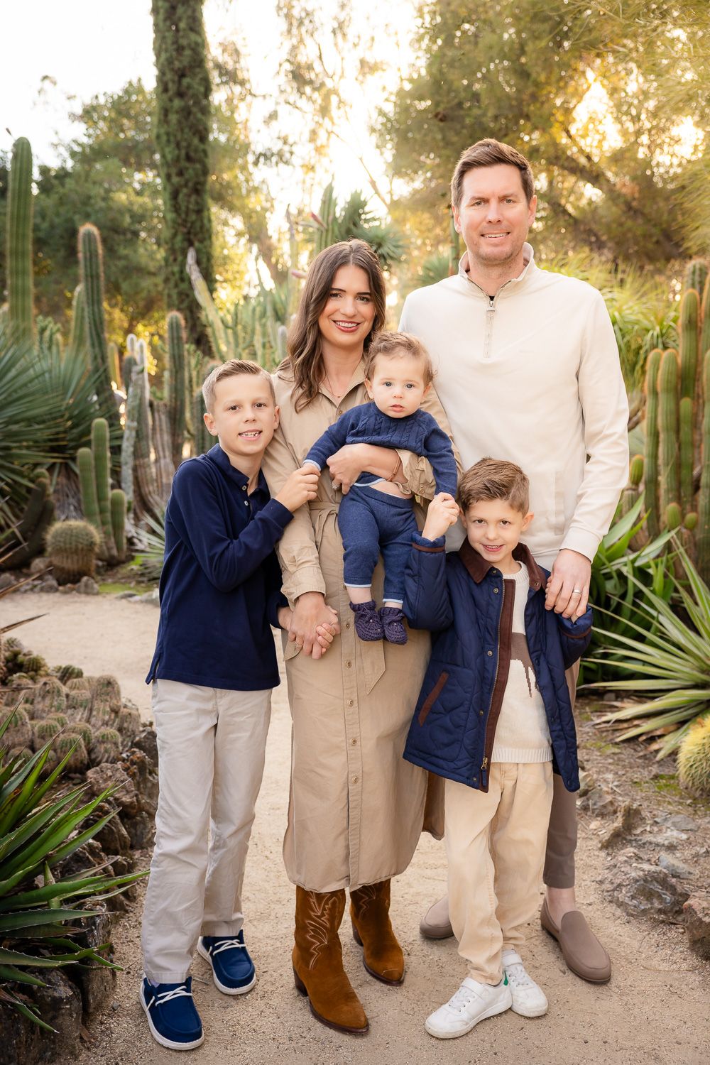 A family of 5 poses for the camera during a Bay Area sunset