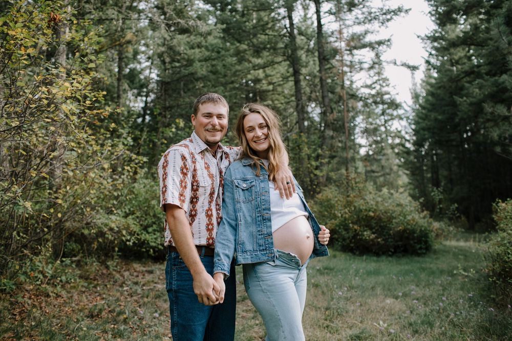 Candid moments captured in a wooded outdoor setting during autumn.