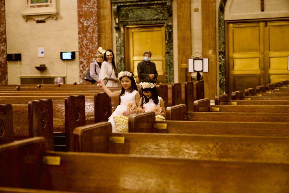 Warm-toned interior of church sanctuary with traditional wooden pews.