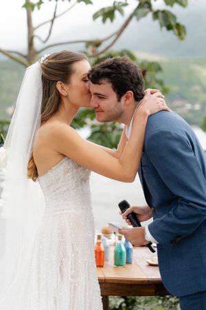 Bride and groom share a romantic moment on their wedding day across five progression photos.