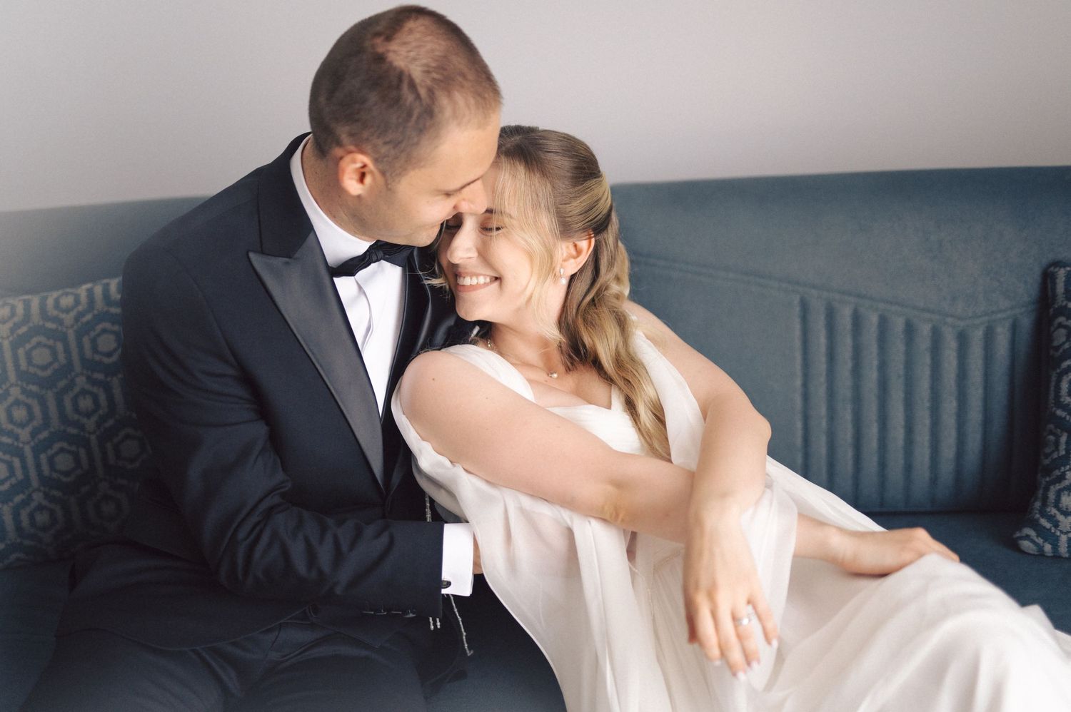 Row of elegant black and white wedding photos showing intimate romantic moments between bride and groom.