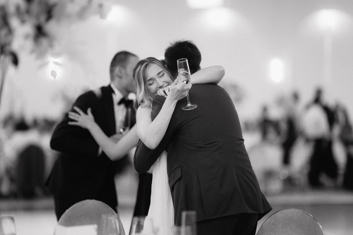 A romantic montage of couples dancing together in elegant ballroom settings with soft lighting and formal attire.
