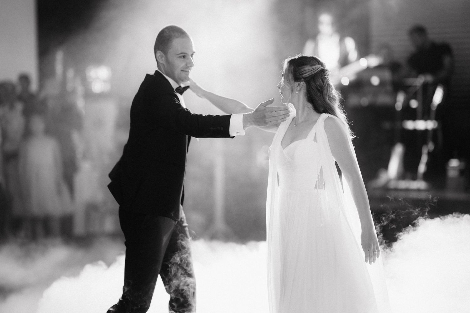 Black and white wedding photography sequence showing intimate dance moments in soft focus.