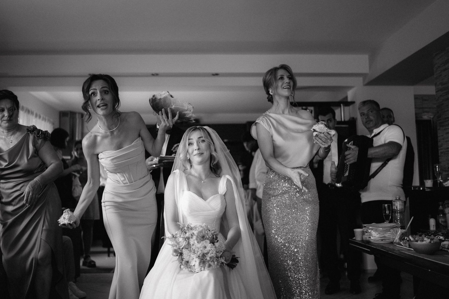 Black and white photos of a wedding celebration sequence showing dance floor moments at a reception.