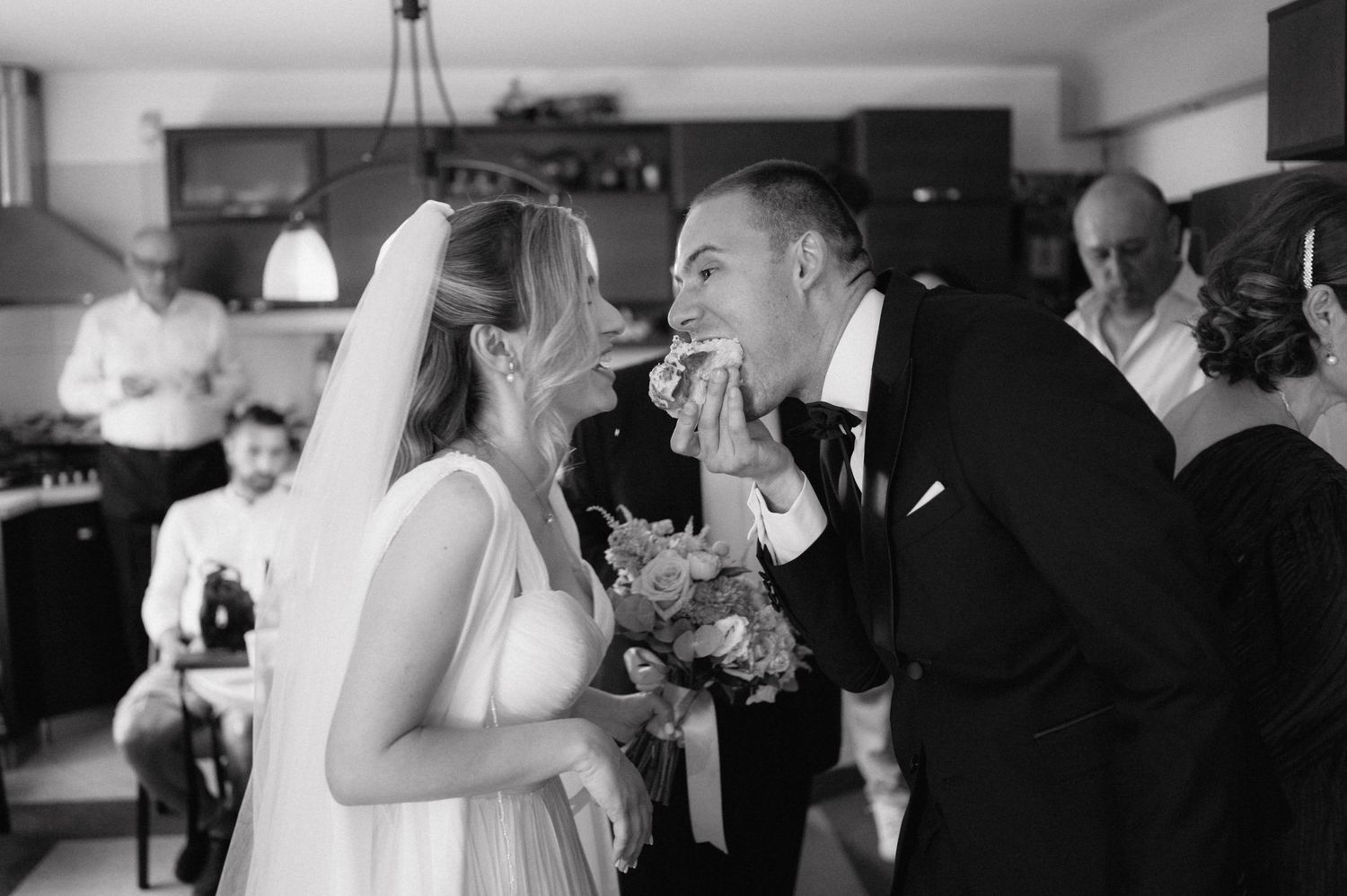A series of black and white wedding reception photos showing people dancing and celebrating at different moments.