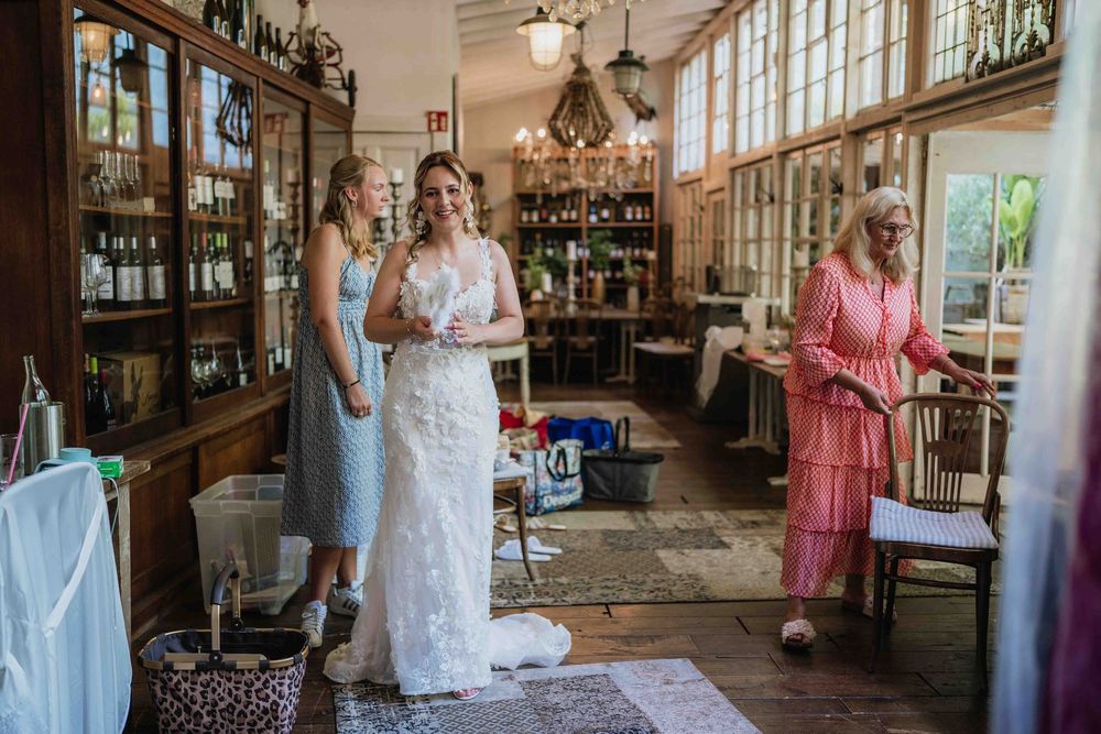 Panoramic view of a vintage-style wedding venue with large windows and wooden details.