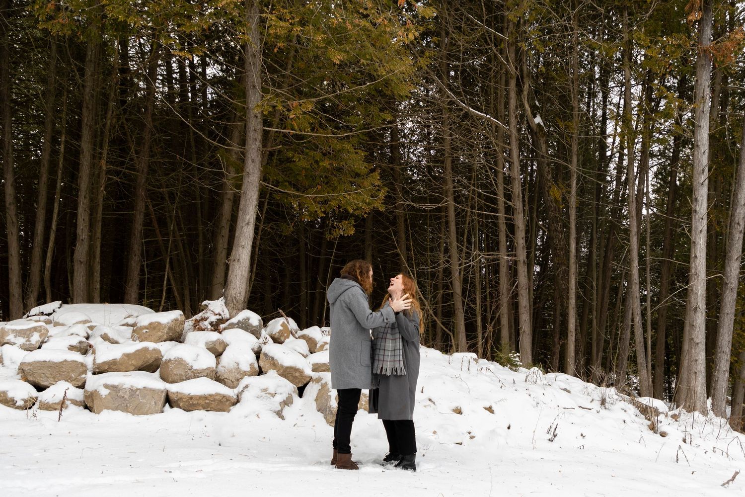 a couple admiring one another on a snowy day