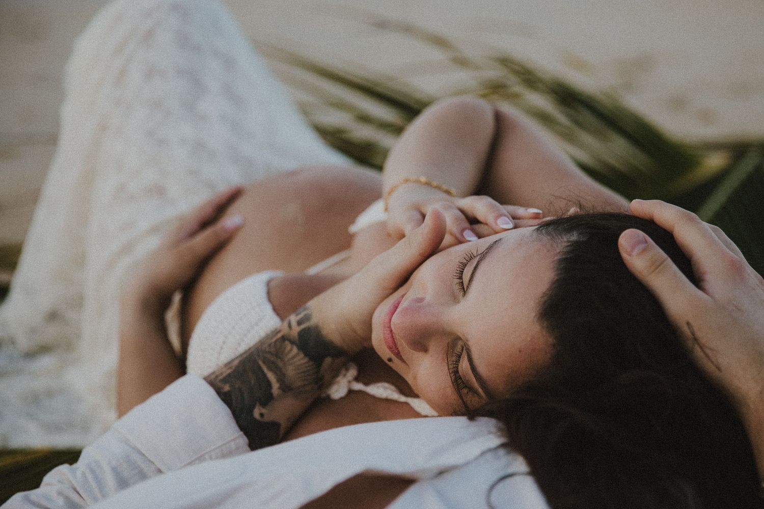 Dreamy beach photography capturing intimate moments between couple.