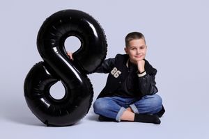 Black number 8 shaped inner tube float shown from different angles against a white background.