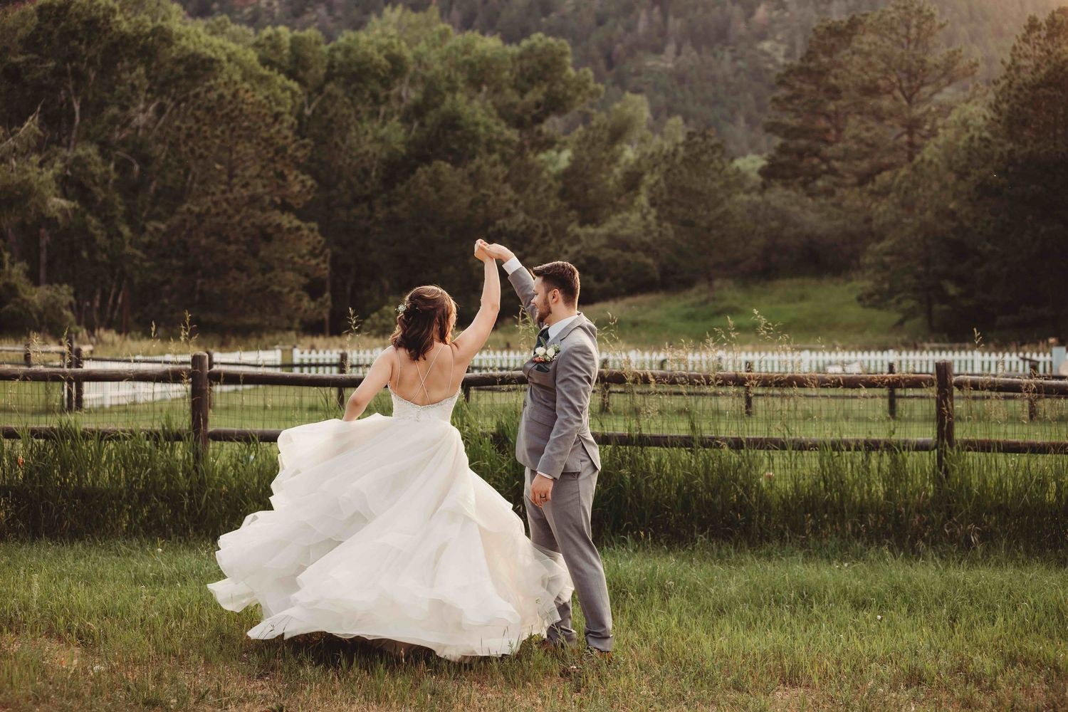 Seven romantic wedding photos showing a couple in formal attire walking and posing in a serene countryside setting.