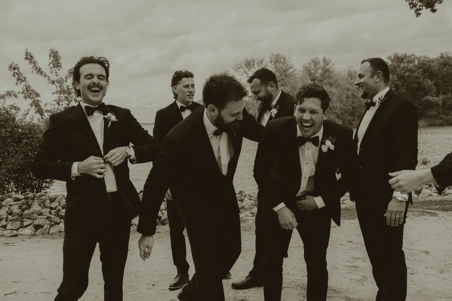 A private beach wedding in Celina Ohio with the groomsmen doing their group photos.