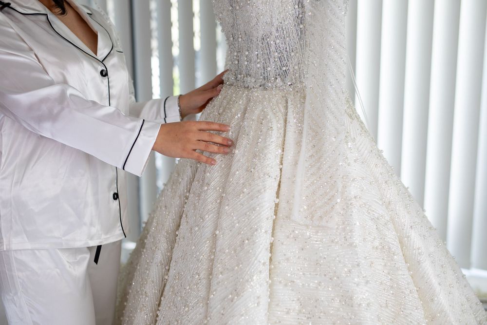 Bride touch her bridal and wedding dress on her wedding day in Sydney, wedding ring and wedding shoes