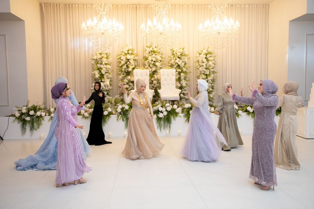 muslims dancing at wedding reception decoration at Eden Venue, with female photographer in Sydney