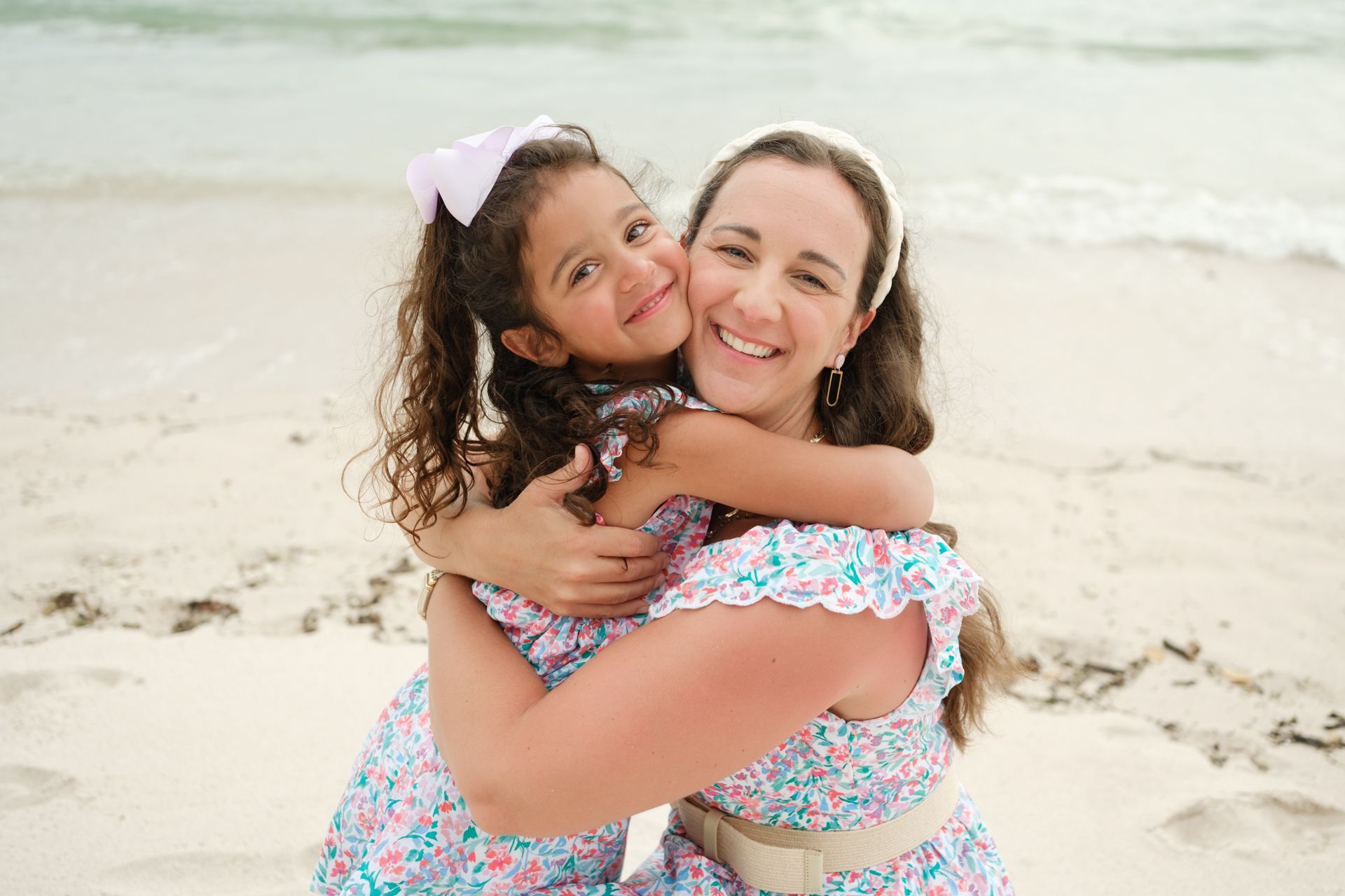 Punta Mita family photography session, beach moments with waves splashing during natural coastal light.