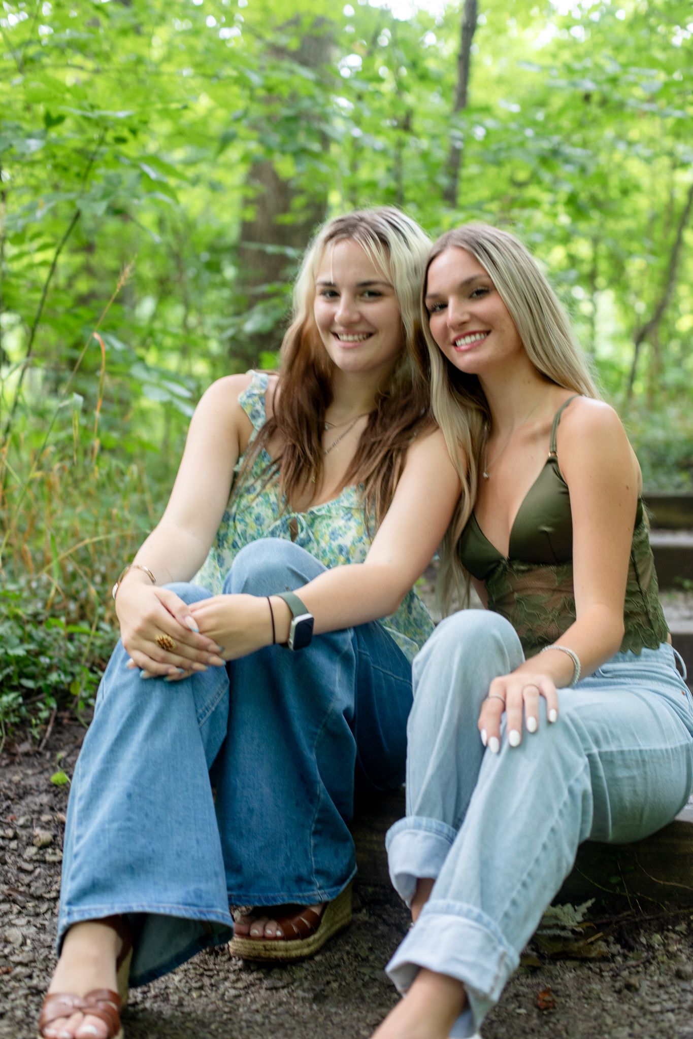 Outdoor senior photo of twin teens in Cincinnati natural setting with professional styling for high-end portrait clients