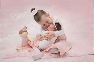Six soft pink ballet photographs showing graceful dance poses with gentle movements and flowing fabric.