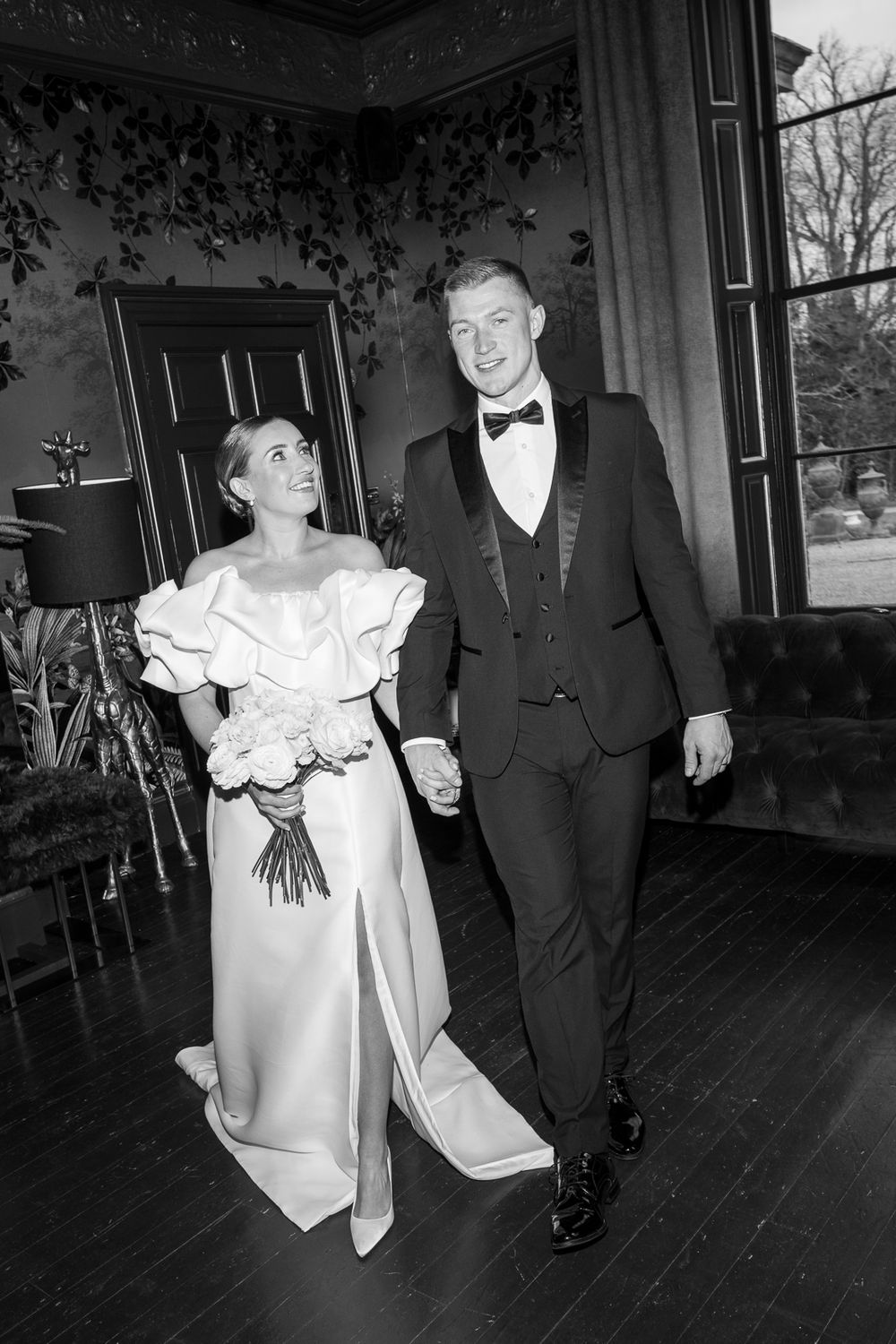 Vintage black and white photo series showing a couple in formal evening wear dancing in an elegant room.