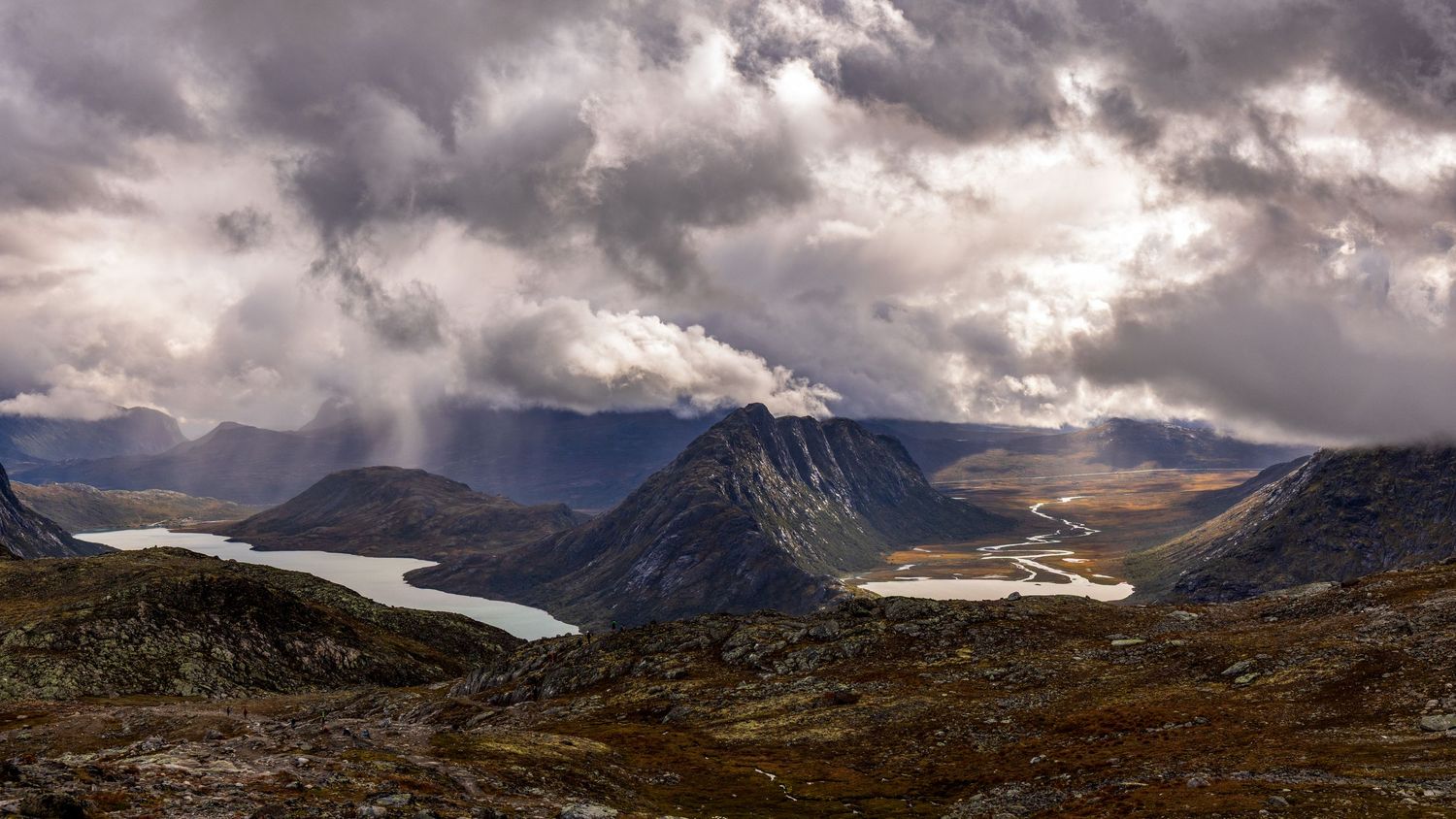 Storm clouds over Jotunheimen National Park in Norway, as seen from Besseggen Ridge while hiking