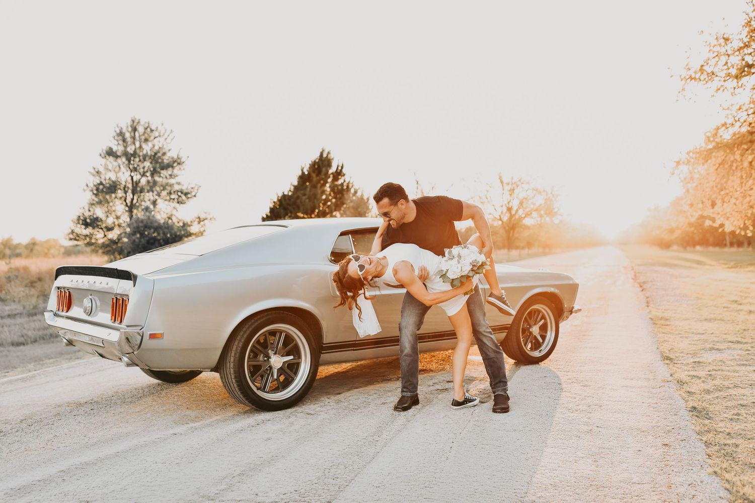 DFW engagement photographer capturing editorial couple session with classic muscle car