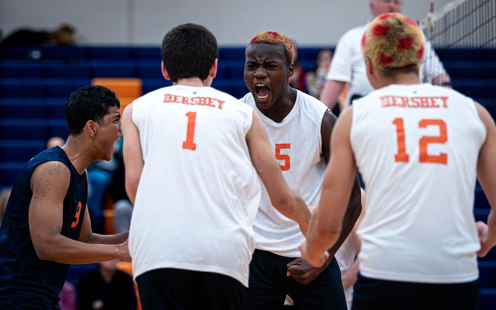 Hershey Trojans boys volleyball team celebrates a point vs Mechanicsburg at Hershey High School, April 2026 — SportsFox Photography