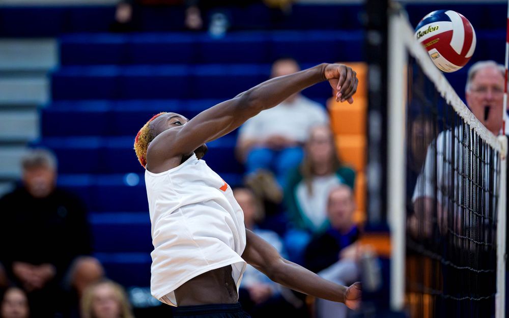 Hershey Trojans player spikes at the net vs Mechanicsburg Wildcats at Hershey High School, April 2026 — SportsFox Photography