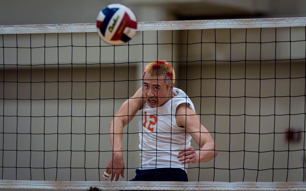 Hershey Trojans #12 spikes the ball at the net vs Mechanicsburg Wildcats at Hershey High School, April 2026 — SportsFox Photography