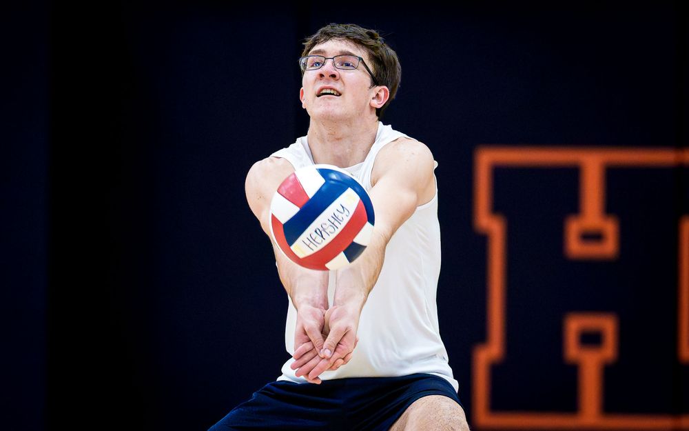 Hershey Trojans player digs vs Mechanicsburg Wildcats in Hershey High School gym, April 2026 — SportsFox Photography